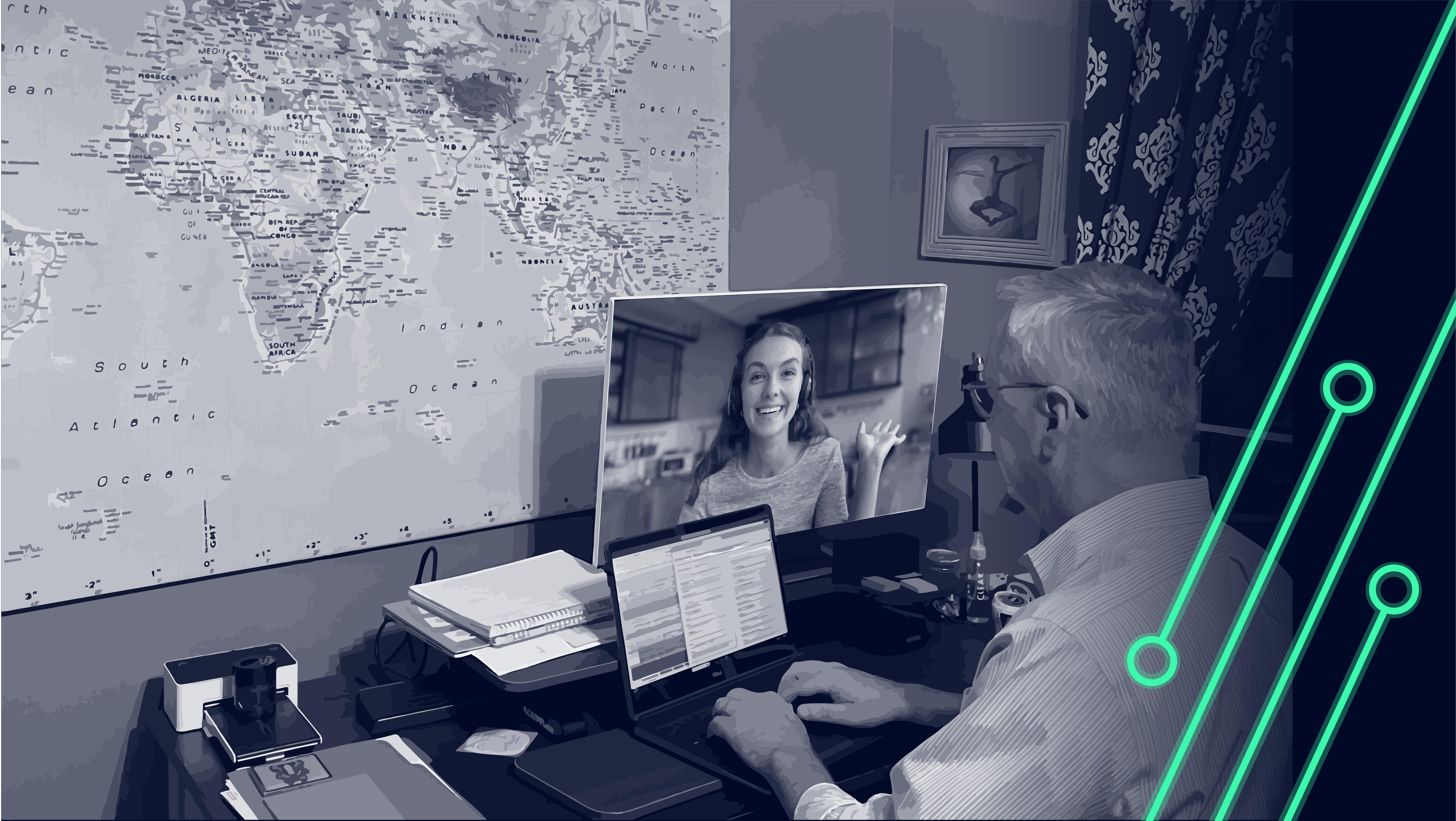 A man at a desk using a laptop, with a map hanging on the wall in the background.